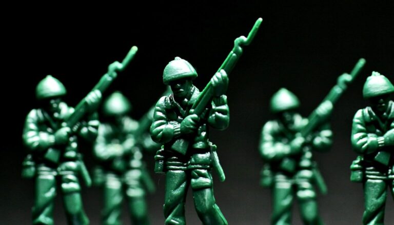 A row of green toy soldiers against a dark background.